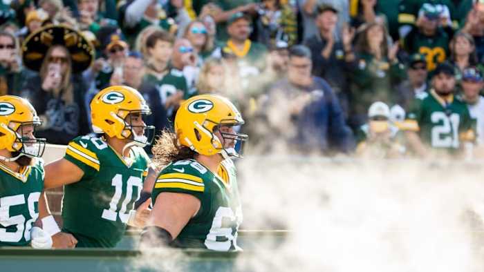 David Bakhtiari (69) and Jordan Love (10)